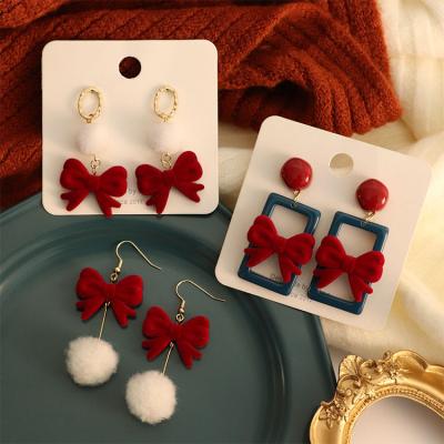 China FASHIONABLE winter new year spring festival wine red bow tassel ball hook earrings girls women fashion earrings for sale