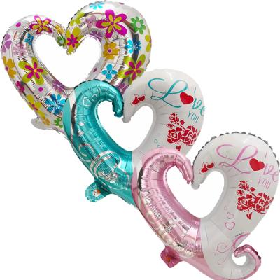 China 18 Inch Heart Shape Festival Decoration Bundle With Flowers Script Letterhole Foil Balloon I Love You For Valentine's Day Wedding Heart-Hole Balloon for sale