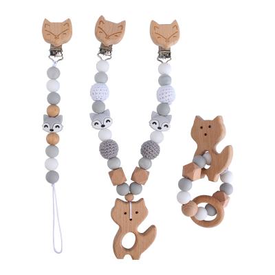 China Eco-friendly Cartoon Beech Wood Fox Star Baby Pacifier Chain Teether Bracelet Teether Chain Teether Set for sale