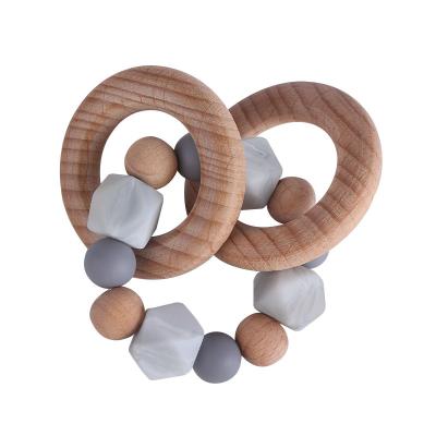 China 100%food grade silicone New DIY Food Grade Silicone Teether Beads Beech Wood Ring Teether Baby Teething Rattle Sensory Toy for sale