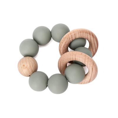 China 100%food grade Silicone Teether Baby Silicone Teether Toys Wooden Teether Ring Teething Bracelet for sale