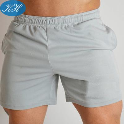 China Custom Anti-Wrinkle Active Wear Quick Dry Mens Pocket Workout Shorts for sale