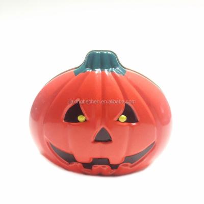 China Recycled Materials Halloween Tin Food Storage Containers Pumpkin Shaped Tin Box for sale