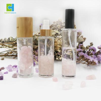 China Eco-Friendly Recyclable Natural Healing Elixir Infused Lid Glass Crystal Perfume Spray Bottle Bamboo Gemstone for sale