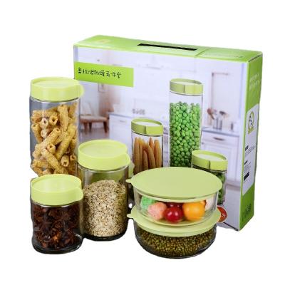 China Custom Stocked Logo High Borosilicate Glass Sealed Food Cereal Storage Containers Cans Kitchen Glass Jar for sale