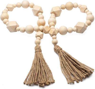 China 100% Custom Made Wholesale High Quality Rustic Vintage Geometric Wooden Bead Garlands Handmade With Tassel for sale