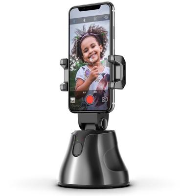 China Universal 360 Rotation Camera Smart AI Video Selfie Selfie Wireless Mobile Adjustable Rotating Tik Tok Stand Phone Holder for sale