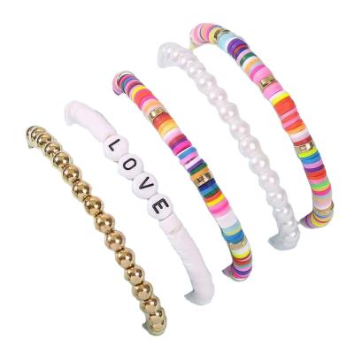 China Environmentally friendly summer fashion beach jewelry hot selling bohemian LOVE temperament colorful soft bead pottery handmade bracelet set of 5 pieces for sale