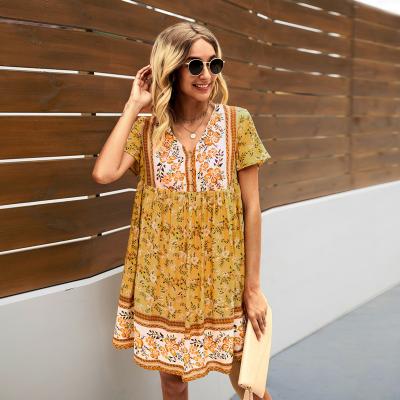 China Viable Dress 2022 Summer Women Vintage Floral Print Boho Dress V-Neck Button Short Sheath Peplum A-Line Casual Dress for sale