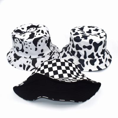 China 2021 New Image Cow Printing Bucket Hat Reversible Black White Black Summer Sun Covers For Women Fisherman Hat for sale