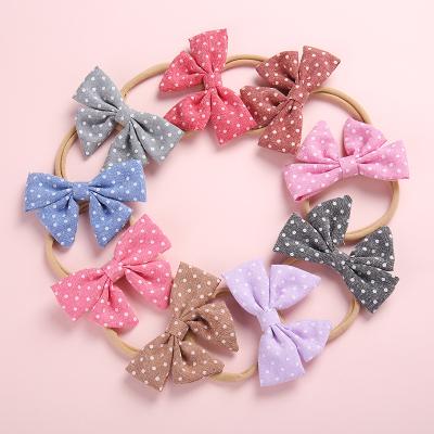 China Kids and girls hair accessories baby hair band accessories bow nylon hair band polka dots web headbands for sale