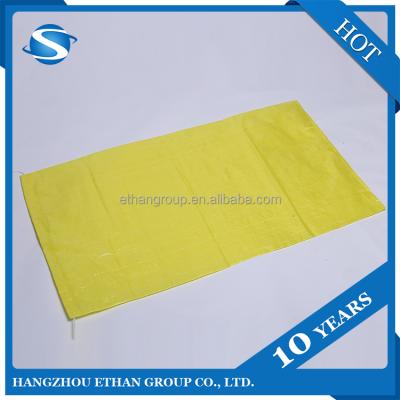 China 2021 Yellow Moisture Proof PP Woven Bag For Flour Feed Seed Rice Corn Fertilizer Price Bag 50kg 25kg 5kg 10kg 20kg 1kg 3kg 9kg for sale