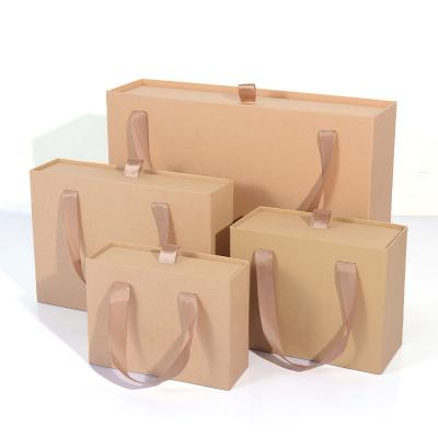 China Custom Design Recyclable Premium Glitter Gift Cardboard Bag Gift Paper Design Paper Bag With Ribbon Handle for sale