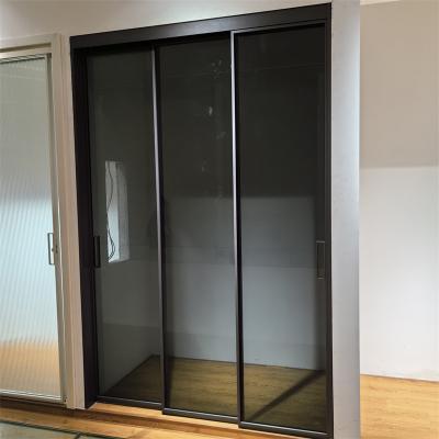 China Simple Three-track Three-linkage Kitchen Sliding Door Balcony Partition Door Double-layer Tempered Glass Door zu verkaufen