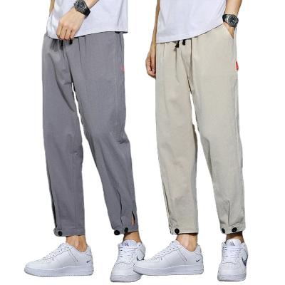 China Custom Boy's Male Casual Plain Solid Logo Drawstring Pants Men's Straight Pants Nine Stitch High Quality Breathable Fashion for sale