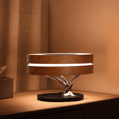 China Mobile Phone Table Lamp Wireless Charger Tooth Speaker Night Light Circle Blue Fill Tree Shape Wooden Table Light for sale