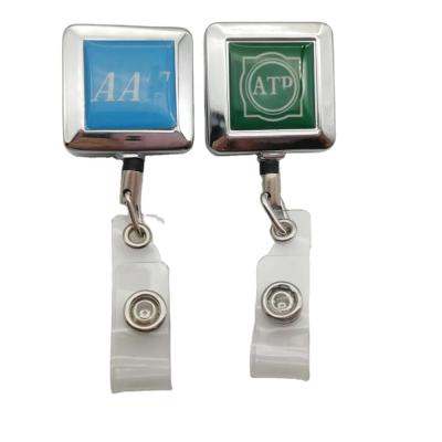 China Luxury Zinc Alloy Easy Pull Buckle Badge Reel Bling White Custom Logo Badge Reel for sale