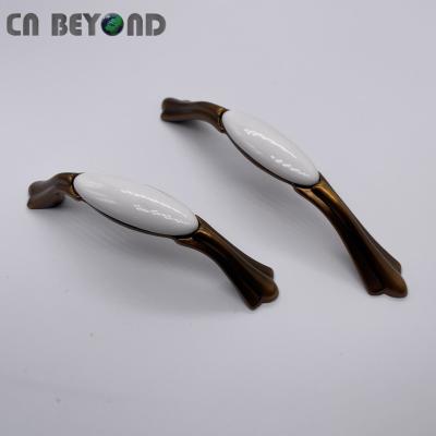 China Durable Antique Arched White Hardware Handle Ceramic Dresser Cabinets Pulls for sale