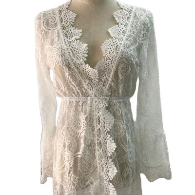 China HOT Selling Breathable White V Neck Sexy Embroidery Lace Up Vacation Mini Dress Women Beach Mini Dress Long Sleeve Cut for sale