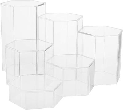 China High Precision Crystal Clear Hexagonal Acrylic Jewelry Figure Showcase Display Riser Racks With Transparent Cavity Bottoms for sale