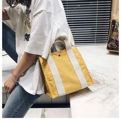 China 2021 New Design Student Simple Canvas Tote Handbag Female Shoulder Messenger Handled Wholesale Bag for sale