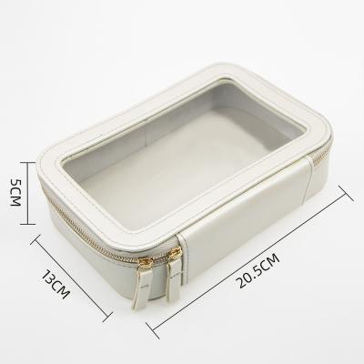 China Clear PVC Toiletry Bag Makeup Cosmetics Bag Durable Luxury Personalized Genuine Leather Bag Women Clear for sale