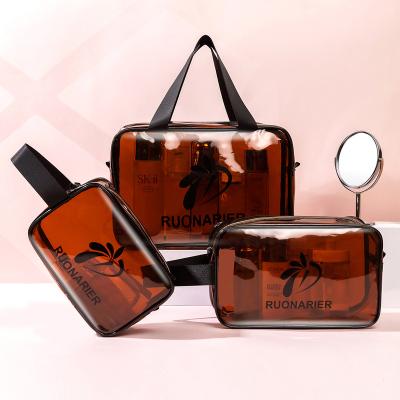 China Custom Logo Travel Transparent Fashion PVC Waterproof Beach Cosmetic Bag Clear PVC Makeup Bag for sale