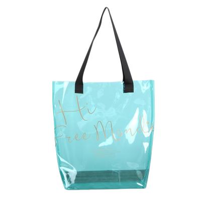 China Durable Fashion Trends PVC Clear Tote Handbag Ladies Shopping Bag Transparent Plastic Beach Bag For Women Jelly Handbag for sale