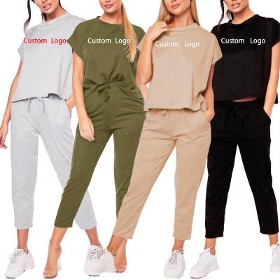 China Oti Textile OEM/ODM QUICK DRY Two Piece Set Women Jogging Suit Loose Short Sleeve Lace Up Pant Sport Tracksuit Women Sport Wear for sale