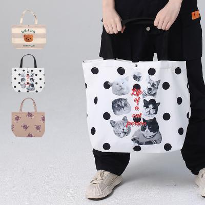 China 2023 new product fashion popular custom handbag ladies women's fashion digital canvas tote bag printing trends wholesale for sale