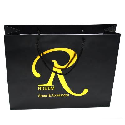 China Recyclable Embossing And Logo Gold Foil Custom Printed Black High Quality Paper Gift Bag for sale