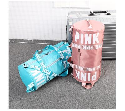 China Pink Custom Fashion Fitness Logo Barrel Shaped Shoulder Bags for Women Large Capacity Travel Men's Duffel Bag Gym for sale