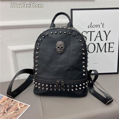 China 2022 European and American style large capacity women's classic PU rivet waterproof punk 3d skull casual backpack black for sale