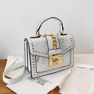 China 2022 fashion hot sale ladies lock luxury handbags pu bags purses and rivet handbags for women for sale