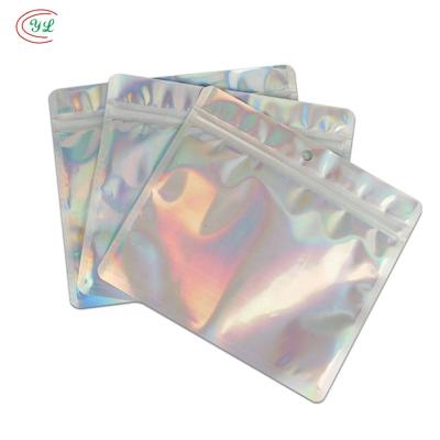 China Moisture Proof Three Side Seal Plastic Flat Pouch With Zipper For Cosmetic Nail Products Packaging / Clear Holographic Sachet Bag for sale