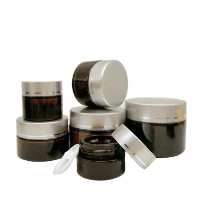 China Custom Gorgeous 5g 10g 20g 30g 50g 100g Amber Cosmetic Jar Glass Cream Jar With Screw Cap for sale