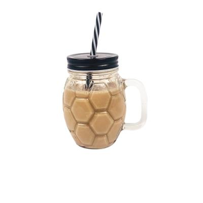 China Juice Wholesale Mason Jar Football Shape With Handle Glass Cup With Lid Straw Water Cup for sale