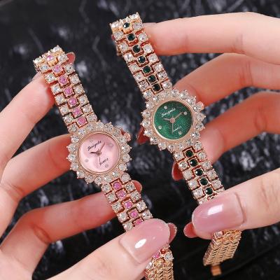 China Crystal Watches Luxury women's watches day/date outlet bracelet 8470 iced out bling women's watch for sale