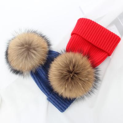 China Medium cashmere knitted winter hats with fluffy raccoon fur pompom fur ball knitted beanies for sale