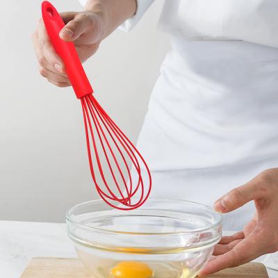 China Viable Silicone Egg Beater With Handle Factory Food Grade Plastic Manual Egg Beater Kitchen Tools for sale