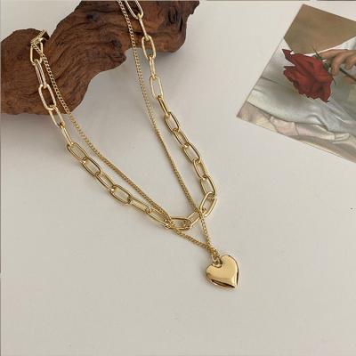 China Custom High Quality Geometric Multilayer Gold Plated Half Pearl Chain Necklace FASHIONABLE Half Heart Necklace for sale