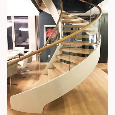 China Modern Indoor Low Cost Curved Steel Wooden Staircase Design With Glass Railing for sale