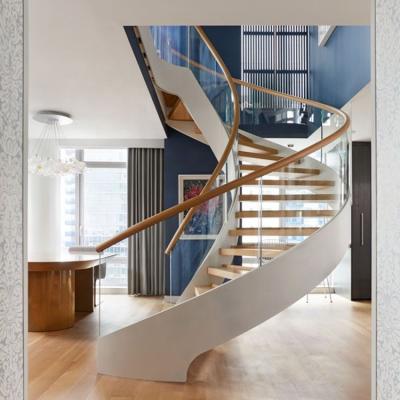 China Modern Mesense Curved Staircase With Glass Balustrade And Red Oak Treads Use Indoor Arc Staircase for sale