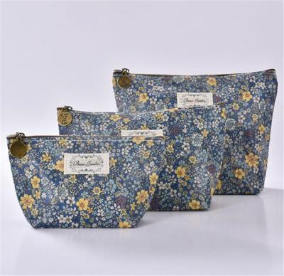 China Fashion 3 Sizes Promotional Cosmetic Bag Fold Up Cosmetic Bag Blue Flower Cosmetic Bag for sale