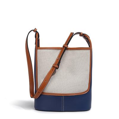 China Latest Korean chic fashion canvas bucket handbag color clash shoulder bags for women mini adjustable chain bags for sale