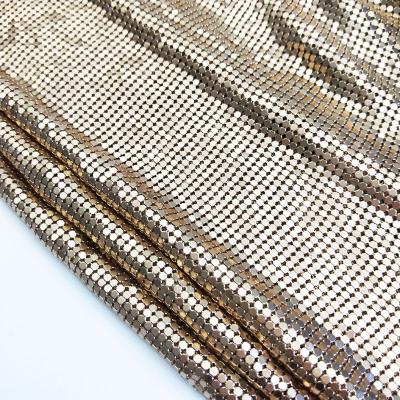 China Soft Durable Flexible Metallic Light Gold Chainmail Fabric Metal Sequin Aluminum Mesh Fabric For Dressing Curtains for sale