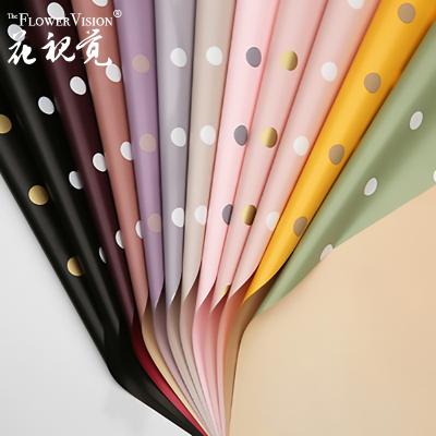 China Dot Design High Quality Korean Plastic Flower Biodegradable Hot Selling Wrapping Paper Waterproof for sale