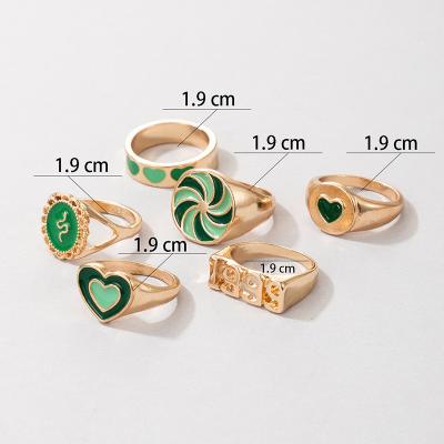 China New Nan-Tchang Auyan Cute Green Ring With Dripping Oil Heart Windmill Snake Shape Alloy Ring Set for sale