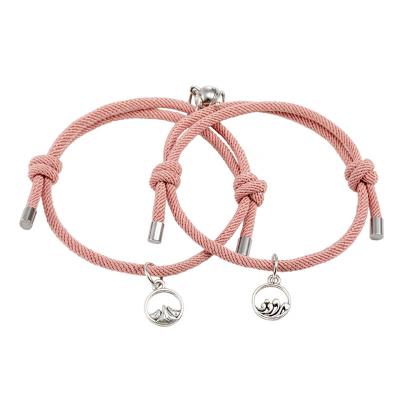 China New Trendy Fashion Couple Bracelets Charm Magnetic Pendants Braided Rope Bracelet With Magnetic Bells for sale