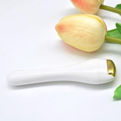 China Wrinkle Remover Mini Home Beauty Products 24K Gold Face And Neck Lift Massager Eye Roller Massager for sale